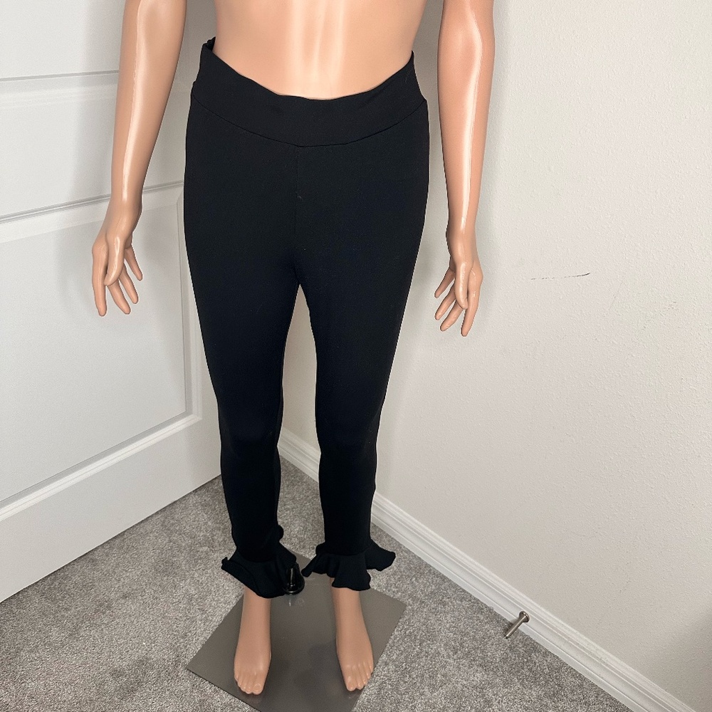 Bebe Black Ruffle Knit Leggings for flare details at the bottom in size XS.